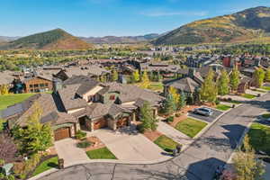 Birds eye view of property with a mountain view and a residential view