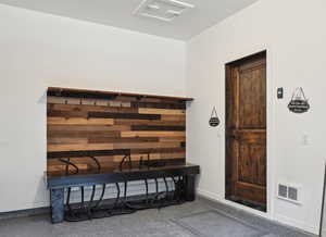 Doorway to property with visible vents