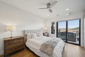Bedroom featuring visible vents, ceiling fan, recessed lighting, wood finished floors, and access to outside
