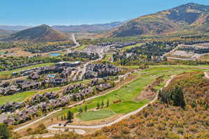 Bird's eye view with a mountain view, golf course view, and a residential view