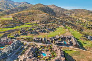 Birds eye view of property featuring a mountain view, a residential view, and view of golf course