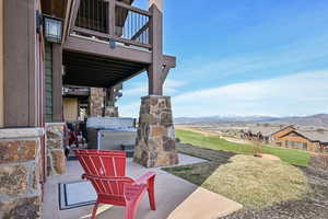 View of yard featuring a mountain view and a hot tub