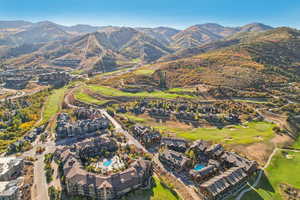 Bird's eye view with a mountain view and view of golf course