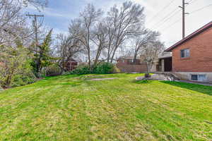 View of yard featuring fence