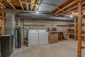 Unfinished basement with washing machine and dryer