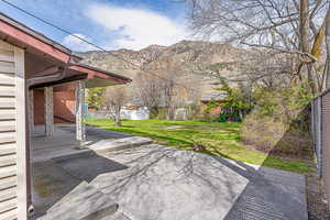 View of patio / terrace with a mountain view and fence
