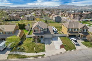 Birds eye view of property with a mountain view and a residential view