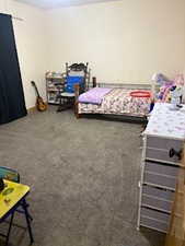 Bedroom with carpet flooring