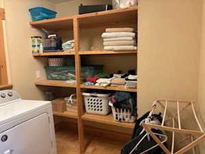 Storage area featuring washer / clothes dryer