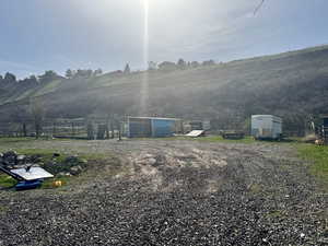 View of yard featuring fence