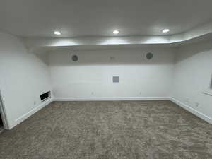 Finished below grade area with recessed lighting, baseboards, and carpet floors