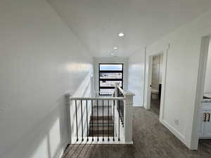 Stairway featuring recessed lighting, carpet flooring, and baseboards