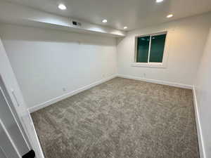 Unfurnished room featuring baseboards, carpet, visible vents, and recessed lighting