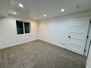 Unfurnished room with recessed lighting, baseboards, and carpet floors