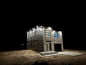 Exterior space featuring stone siding