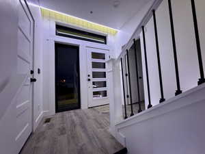 Entryway featuring visible vents and wood finished floors