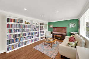 Sitting room featuring ornamental molding, recessed lighting, and wood finished floors