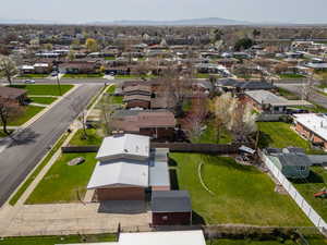 Birds eye view of property with a residential view and a mountain view