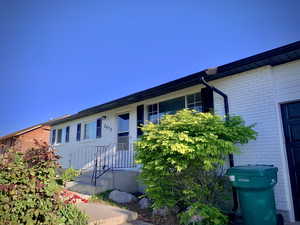 Ranch-style house featuring brick siding