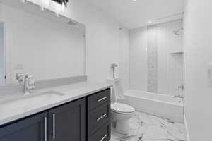 Bathroom with shower / tub combination, vanity, toilet, marble finish floor, and visible vents