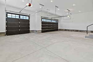 Garage featuring recessed lighting and a garage door opener