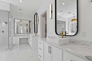Bathroom featuring recessed lighting, visible vents, marble finish floor, and a stall shower