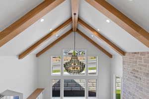 Interior details with an inviting chandelier, recessed lighting, and beam ceiling