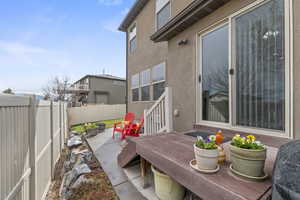 View of patio with a fenced backyard