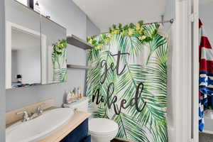 Bathroom with toilet and vanity