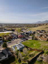 Birds eye view of property featuring a mountain view and a residential view