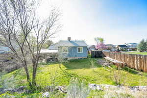 View of yard featuring fence