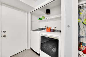 Laundry room with washer and dryer and laundry area
