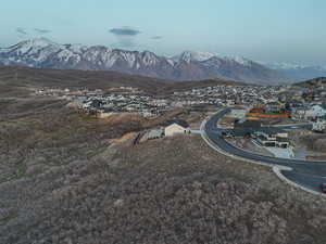 Property view of mountains with a residential view
