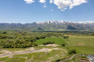 View of mountain backdrop featuring rural landscape