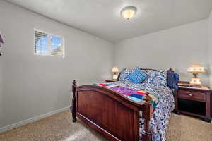 Carpeted bedroom with baseboards