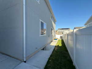 View of yard featuring fence