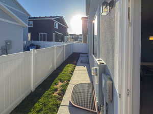 View of yard featuring a fenced backyard and a residential view