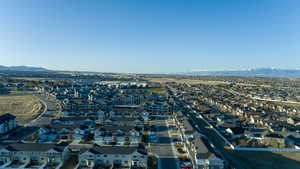 Drone / aerial view featuring a mountain view and a residential view