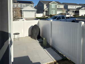 View of patio with a residential view and fence private yard