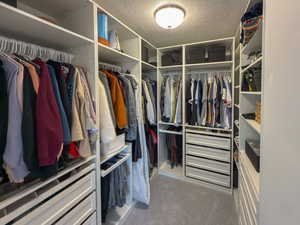 Spacious closet with carpet floors