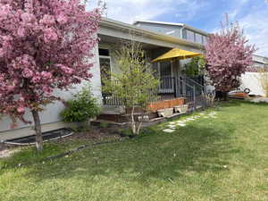 View of front facade with fence and a front yard