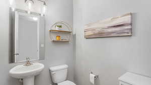 Bathroom with a sink and toilet