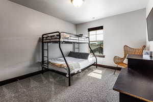 Carpeted bedroom with visible vents and baseboards