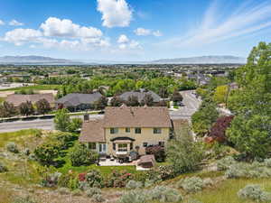 Aerial view of property and surrounding area with mountains