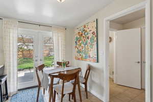 Dining room with French doors, walks into laundry room and door into the garage