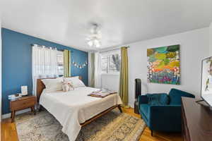 Primary bedroom with hardwood floors