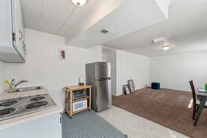 Mother-in-law space with cooktop stove and refrigerator
