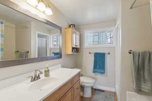 Full bathroom with separate tub and shower and large vanity