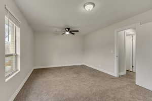 Bedroom #1 featuring baseboards and a ceiling fan
