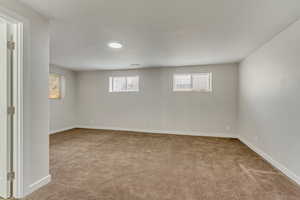 Interior space featuring baseboards and plenty of natural light